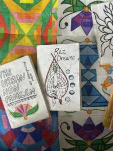 A variety of art materials, drawings, colors and patterns